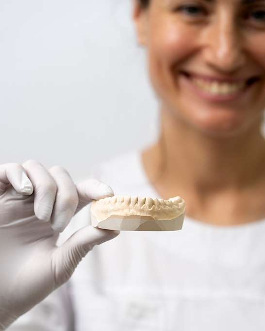 Patient smiling after dental implant treatment