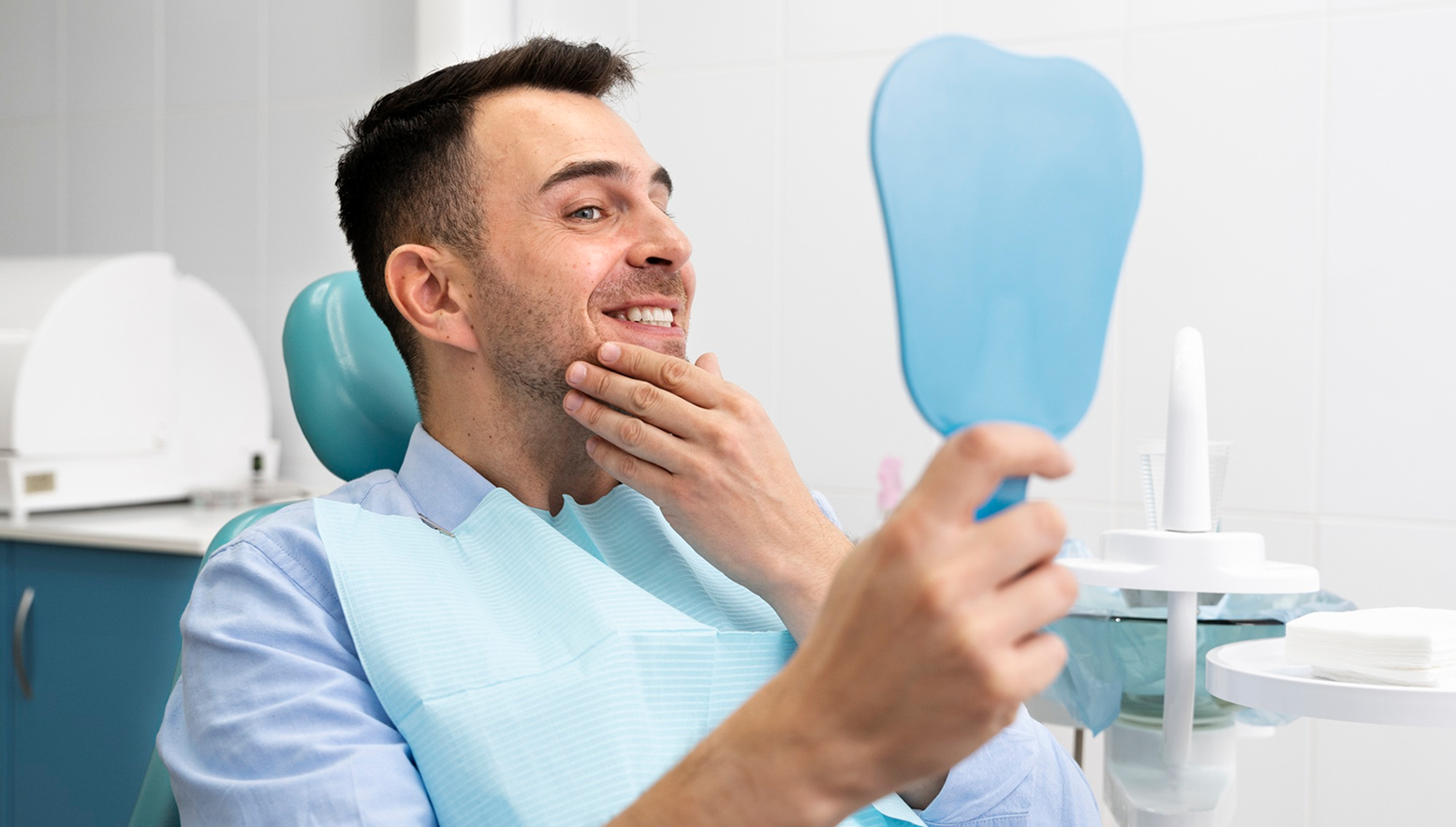 Patient examining dental implant results